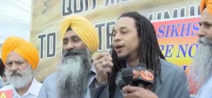 “We Stand,” Says Black Activist at World Hindu Congress Protest
